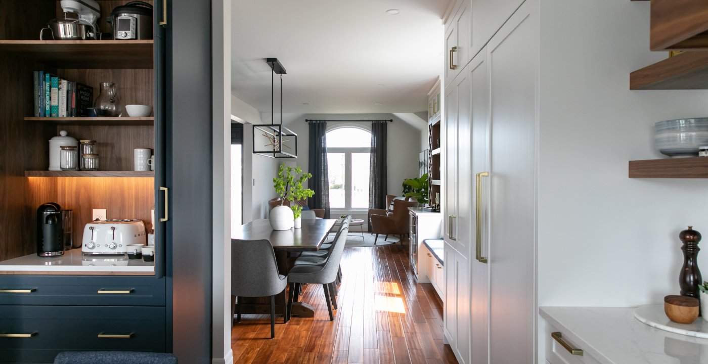 Custom Cabinets With White Shaker Doors, Navy Drawers, And Walnut Shelves.